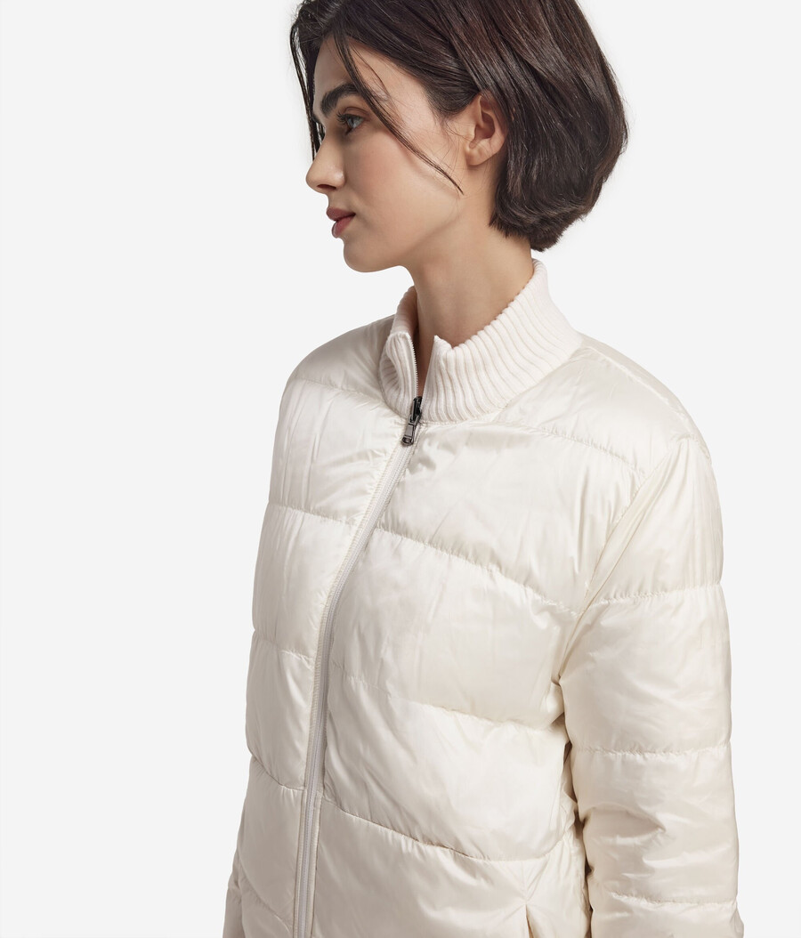 piumino reversibile con lavorazione a trecce in cashmere e tessuto tecnico.