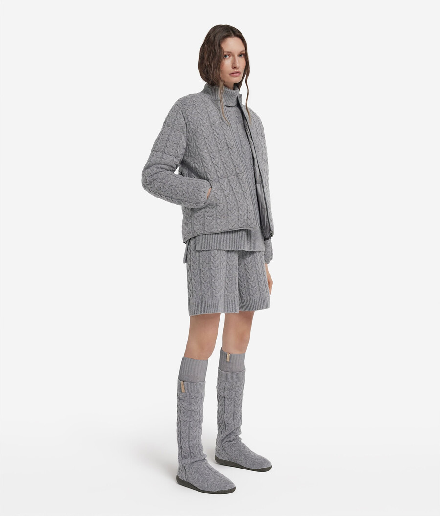 piumino reversibile con lavorazione a trecce in cashmere e tessuto tecnico.