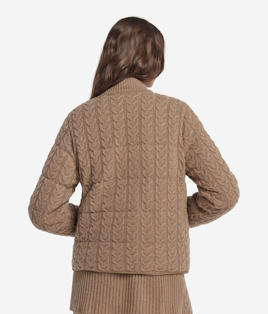 piumino reversibile con lavorazione a trecce in cashmere e tessuto tecnico.